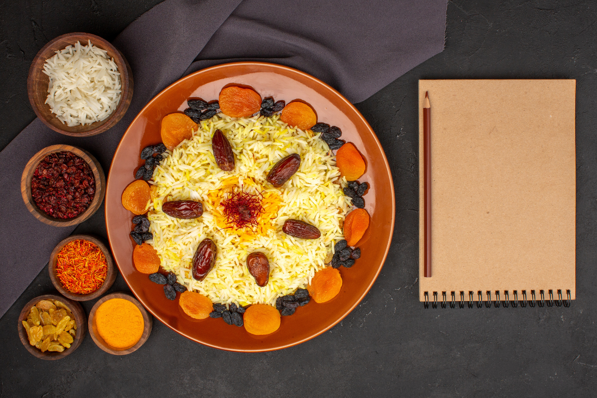 Fluffy Indian saffron rice in a rice cooker, steaming and ready to serve
